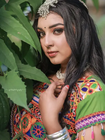 A vibrant and energetic series celebrating Navratri. The model is dressed in colorful Garba attire, and the photos capture the festive spirit through dynamic poses and joyful expressions.