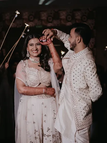 A grand entrance for the happy couple. Guests holding sparklers created a beautiful, illuminated pathway, making for a truly magical and memorable welcome.