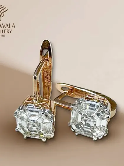A product shot of the square illusion-set diamond drop earrings. The clean lines and brilliant sparkle are highlighted in this clear, detailed image.