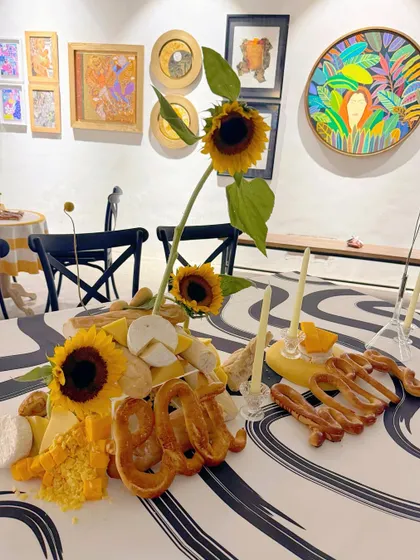 The 'Happy' bread sculpture as part of the larger edible arrangement.