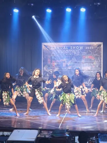 A tribal-themed performance, featuring earthy costumes and powerful, grounded movements.