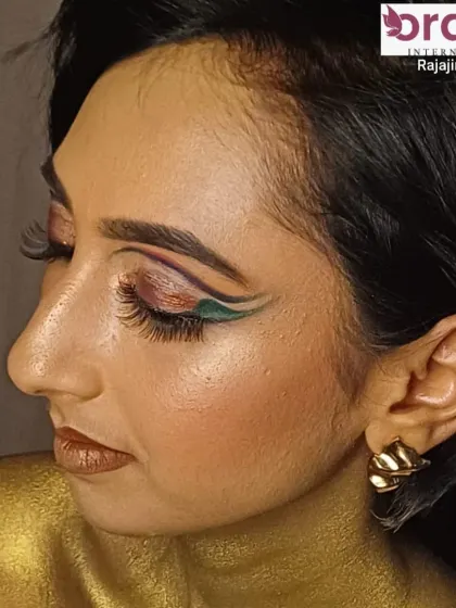 A side profile of the magazine look, showing the sharp, artistic lines of the eye makeup.
