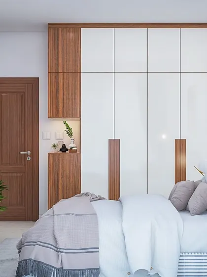 A classic wardrobe design combining white and wood-grain finishes. The unit includes a small, convenient niche next to the door.