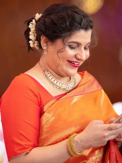 A candid moment of happiness. The makeup looks fresh and radiant even in a candid shot.