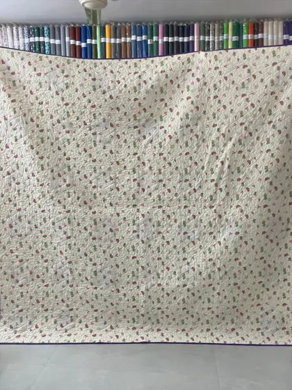 The patterned backing of the hexagon quilt.