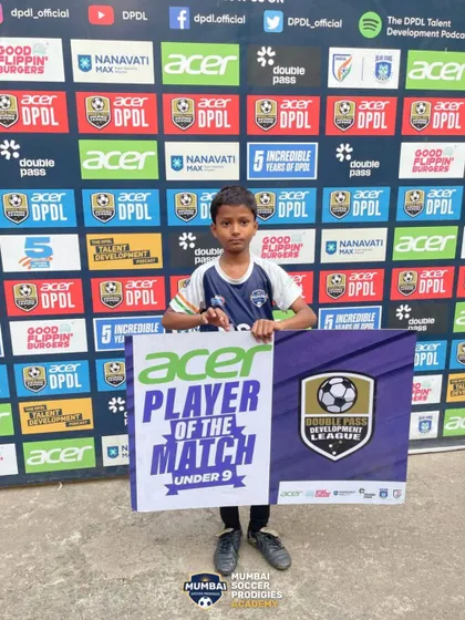 A U9 player recognized as Player of the Match.
