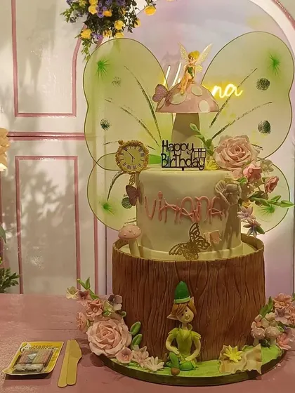 The Tinkerbell cake in its party setting, complete with a neon name sign. We can work with your event planner to ensure our cake perfectly matches your decor.