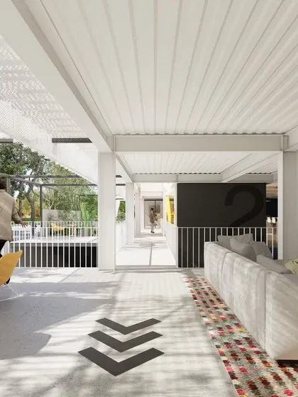 Another view of the co-living community space, showcasing the seamless connection between indoor and outdoor lounges. The design prioritizes shared amenities and flexible seating areas to foster a strong sense of community among young professionals.