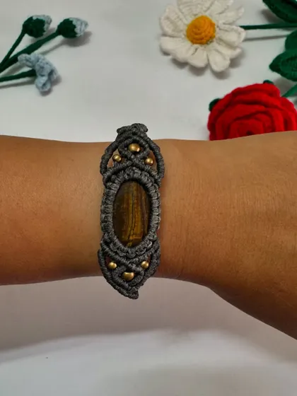 Another view of the Tiger's Eye bracelet on the wrist. The adjustable sliding knot ensures a perfect fit.