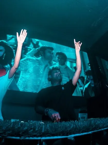 A moment of shared energy with my VJ at a club in Kolkata.