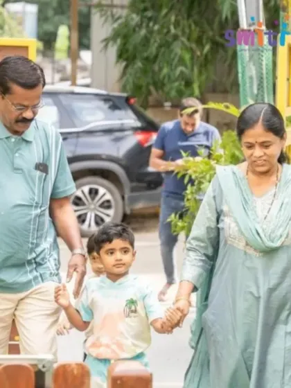A child arrives hand-in-hand with his grandparents, ready for a day of celebration. We cherish these intergenerational connections.