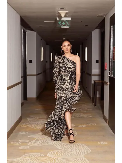 The full-length shot in the hallway captures the cool, edgy vibe of this party look.