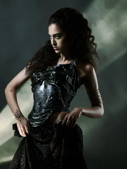 A dynamic pose from the "Ray of Light" series, capturing movement and a strong silhouette.