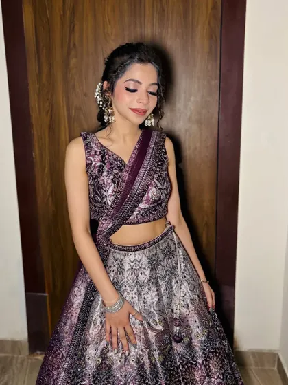 A close-up of the makeup for the purple lehenga look, with soft pink tones on the eyes and lips.