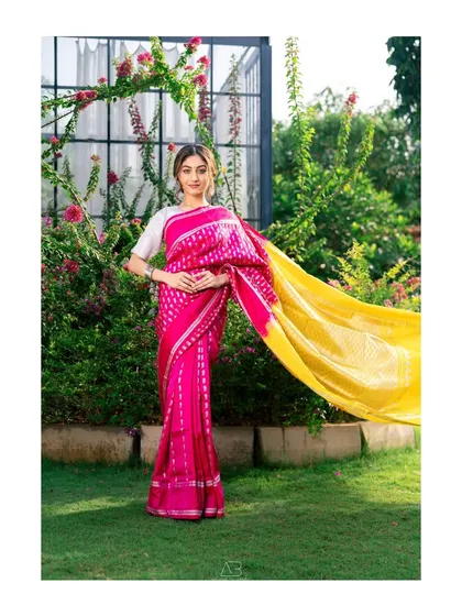 A duplicate of image 100, this shot captures the vibrant colors and graceful movement of the saree in a lovely outdoor setting.