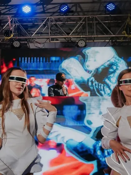 Step into the Toy Room Club, where futuristic dancers and a top DJ create a surreal and exciting party atmosphere, bringing our couple's unique vision to life.