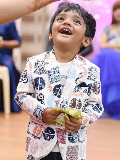 The pure joy on a child's face when receiving a gift. A priceless candid moment.