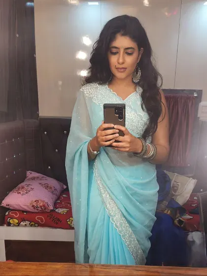 Another selfie in the light blue saree, showing how it looks from a different angle.