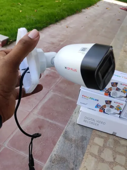 A close-up of a CP Plus 2.4MP full-color bullet camera with audio capabilities, ready for installation.
