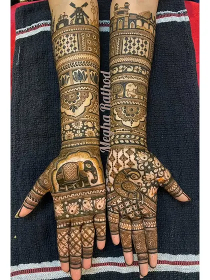 This design tells a story of a journey, with a windmill on one arm and a palace on the other. The palms feature a large elephant and a peacock, blending different symbolic elements.