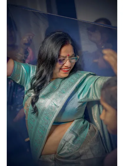 Every candid tells a story of love and bonds. A happy moment of a guest dancing, caught in a swirl of fabric and joy.