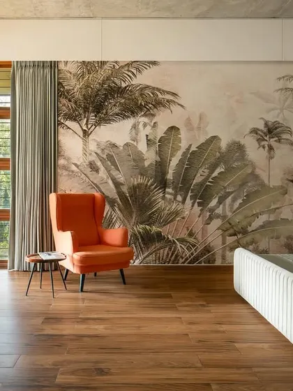 A bedroom should be a private sanctuary connected to the outdoors. In this master bedroom, we used a nature-inspired mural and large windows that open onto a private terrace, blurring the line between the room and the lush landscape outside.