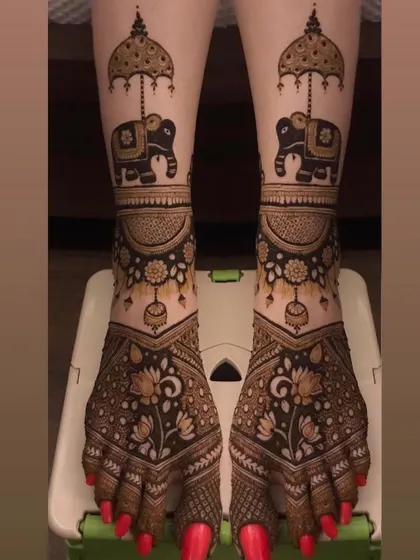 Bridal mehendi isn't just for hands. I create beautiful, detailed designs for feet, like these matching elephants under ceremonial umbrellas, to complete your head-to-toe bridal look.