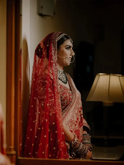 A beautiful reflection shot of the bride, capturing her profile.