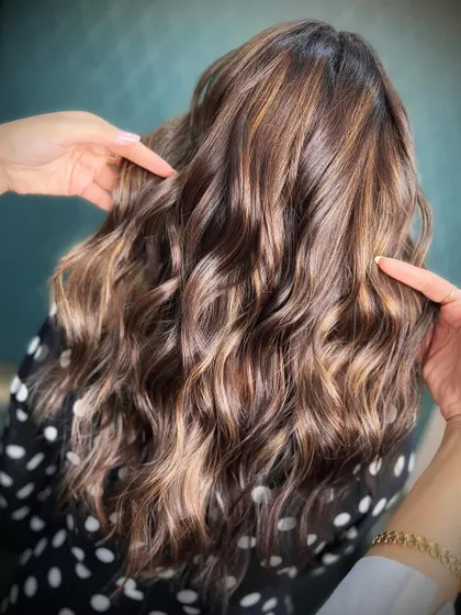 Classic never looked so chic. This image showcases the timeless allure of rich brown hues with subtle highlights.