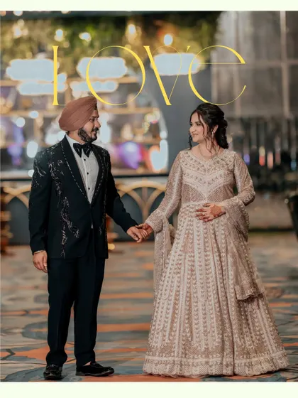 Holding hands and sharing a look of love, Sahib and Ravleen stand in a beautifully decorated venue. The word "LOVE" overlaid on the image perfectly summarizes the moment.