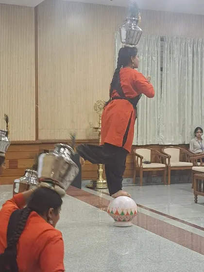 My students demonstrating Jogati Nruthya, balancing pots on their heads, as part of my lecture on intangible heritage.