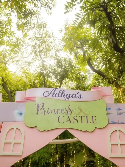Every detail matters in creating a magical world. This personalized 'Princess Castle' entrance sign, nestled among the trees, was the first hint of the enchanting celebration that awaited guests.