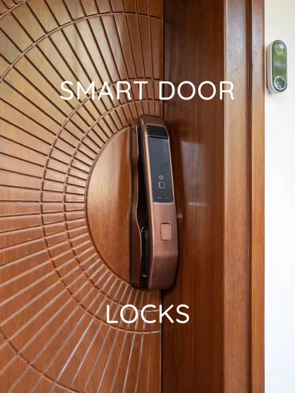 A stylish smart door lock installed on a beautifully carved wooden door, combining modern security with classic design.