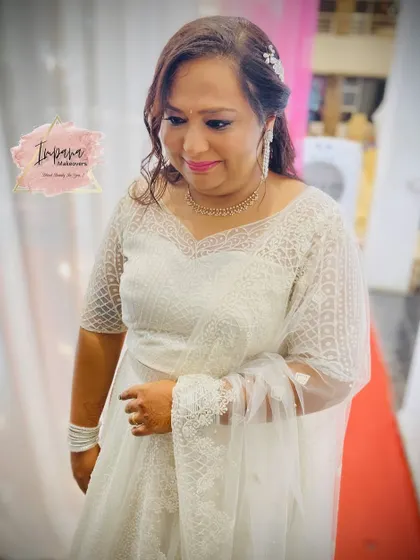 The client looking elegant and happy with her party makeover. The soft hairstyle and diamond jewellery complete this beautiful look.