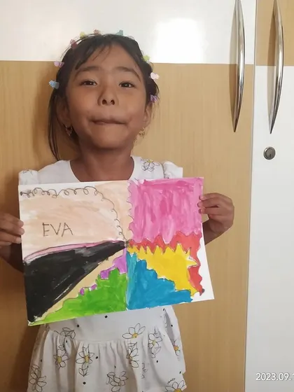 A duplicate of ID 83, this student's pride in her colorful painting is evident. Our online classes build both skills and self-esteem.