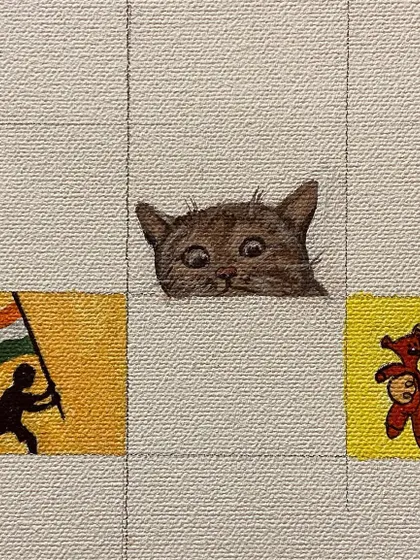 The peeking cat next to a silhouette of someone holding the Indian flag.