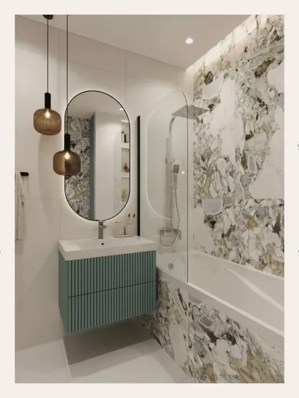 This modern bathroom combines a floating, fluted teal vanity with a bold, patterned marble wall in the shower area for a striking visual contrast.