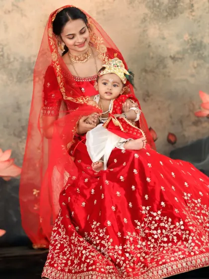 A heartwarming portrait of a mother and her baby, recreating the bond of Yashoda and Krishna. The mother's loving gaze and the baby's divine costume create a truly special image.
