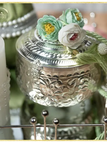 A close-up of the details. I love using embossed silver jars and topping them with delicate handmade flowers and tassels to add a touch of bespoke charm to my hampers.