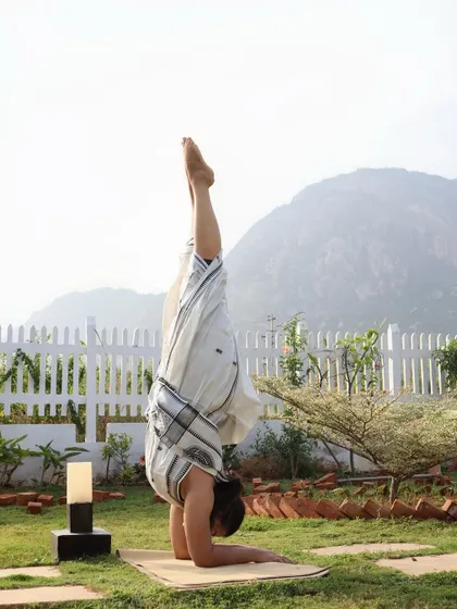 A steady Pincha Mayurasana in my garden, finding balance between strength and the serenity of nature.