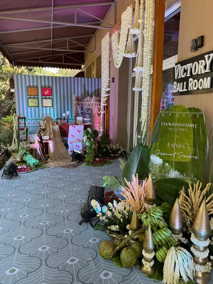 The entrance to the 'Victory Ball Room', where a personalized welcome sign on a banana leaf greets guests to the celebration.