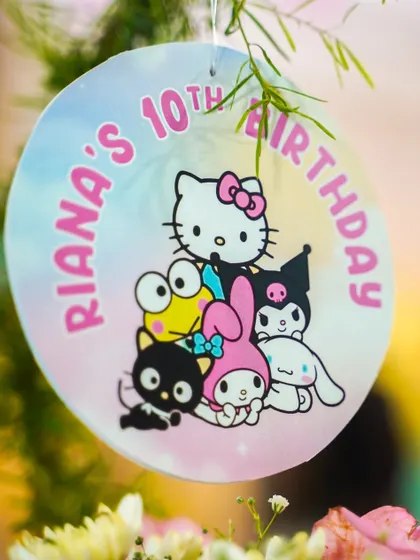 A custom "Riana's 10th Birthday" tag featuring Hello Kitty and her friends.