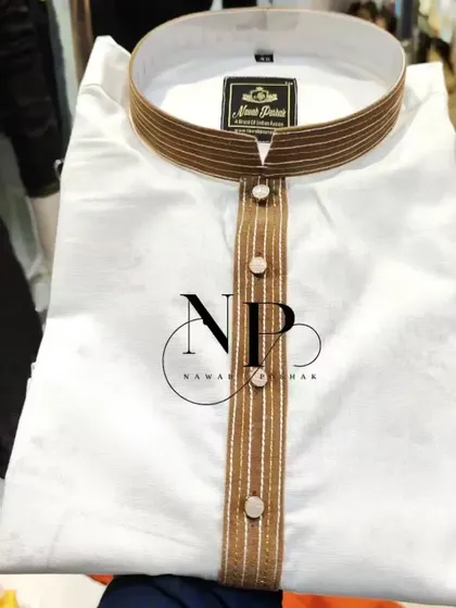 A classic white kurta with a simple yet elegant brown striped collar and placket from the Nawab Poshak collection.