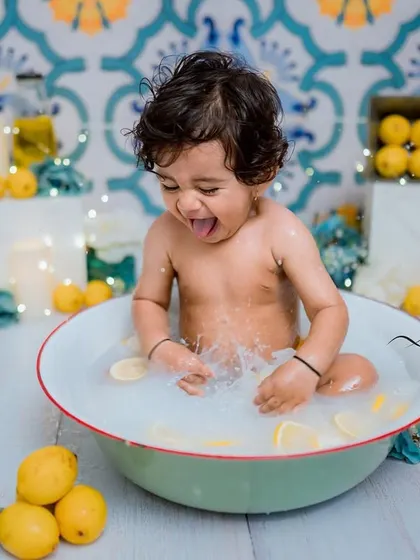 The excitement is real. This little one is having the time of his life in our Italian lemon-themed splash session.