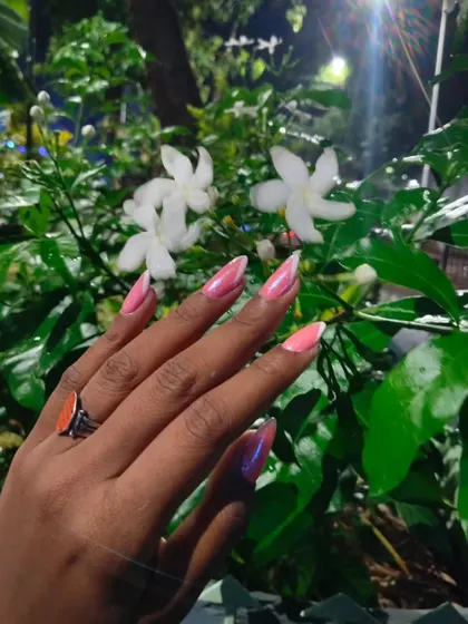 Another look at this sharp pink chrome design. The high-shine finish and precise line work make this a real statement manicure, even with its minimalist color palette.