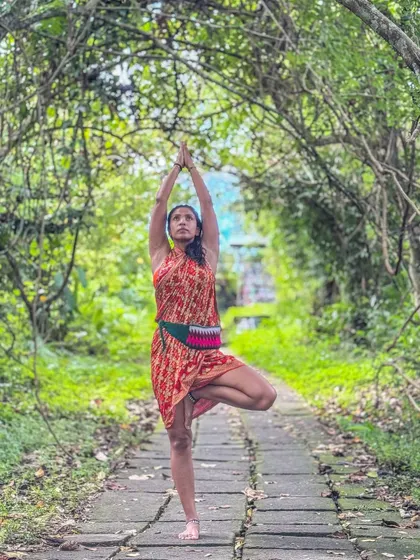 Fully expressing the Tree Pose (Vrikshasana) in the beautiful nature of Ubud. This practice of grounding is a key part of my Bali retreats, helping you connect with the earth and find your center.