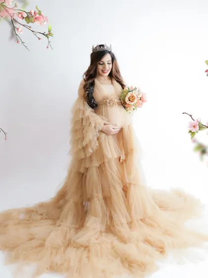 A duplicate of image 179, this fairytale portrait in a flowing nude-colored gown with a tiara is pure magic.