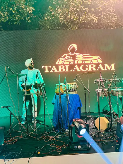 My full setup on stage, ready for a show. The Tablagram logo on the screen reinforces my brand during corporate and club events.