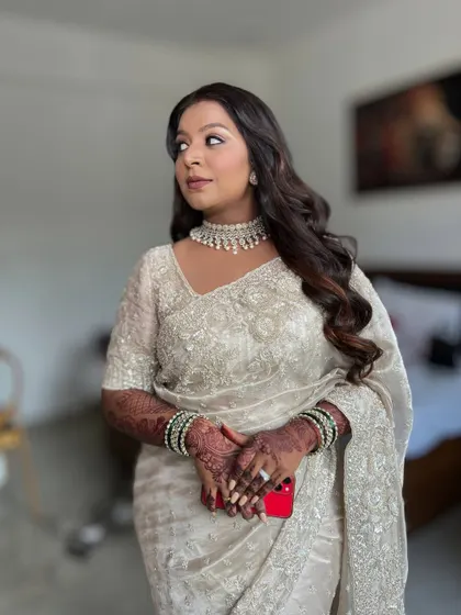 A candid shot of the bride, looking elegant and poised.