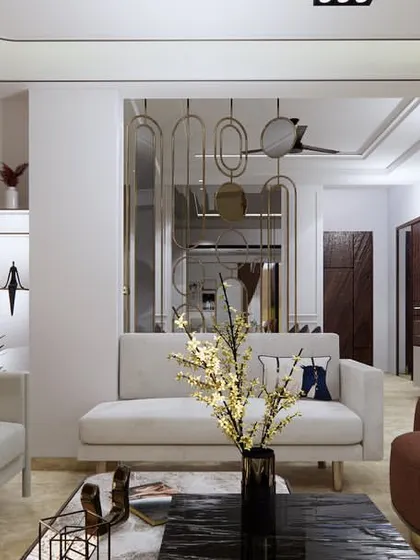 A different angle of the Faridabad drawing room, highlighting the decorative mirror partition that adds a touch of glamour and visually separates the living and dining areas without closing off the space.